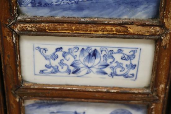 A 19th century Chinese blue and white porcelain panelled screen length 136cm
